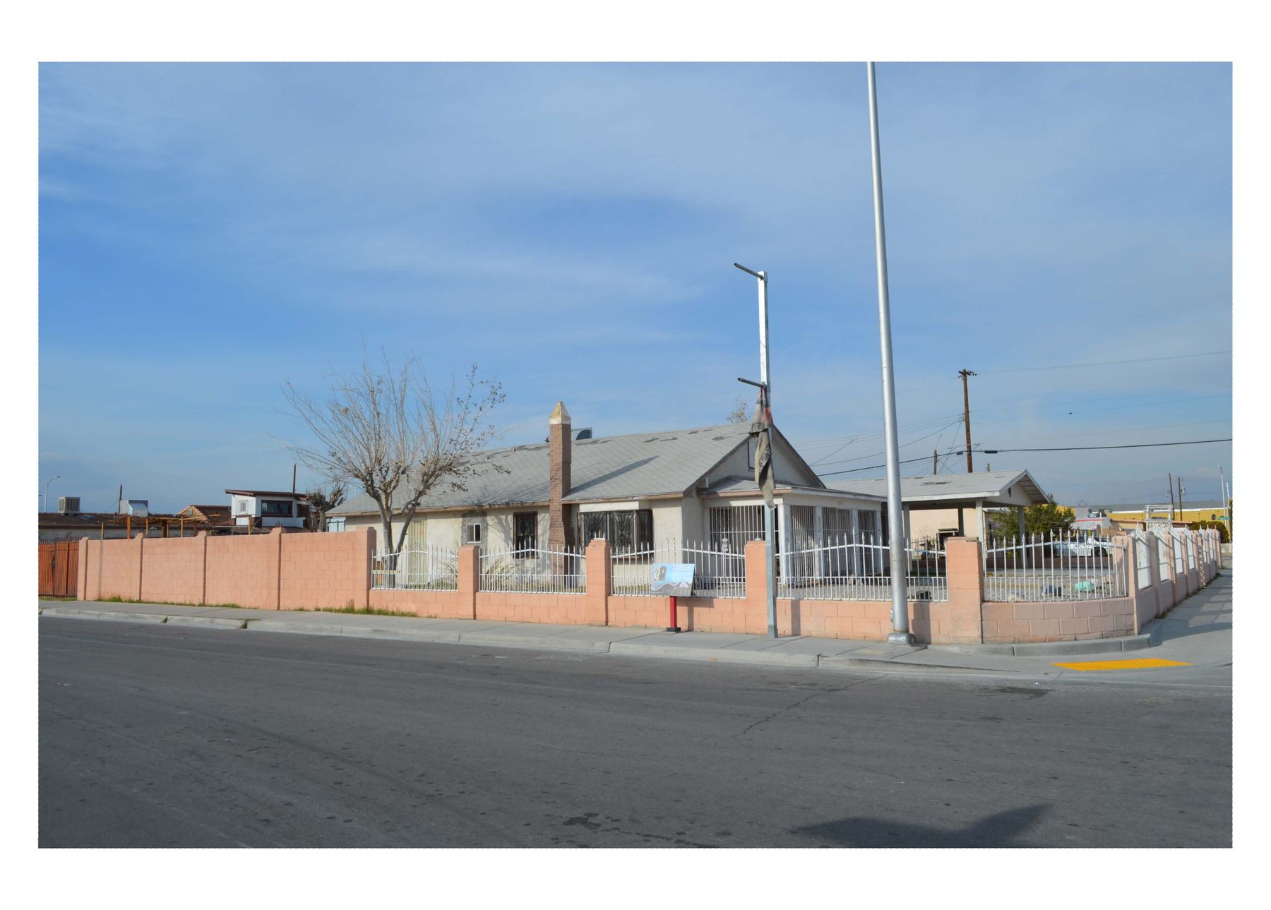 Harrison's Guest House seen from the street, showing the house in the context of its Historic Westside block in Las Vegas.